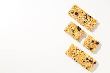 Delicious granola bars on a white background