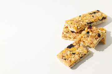 Delicious granola bars on a white background