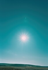 Fototapeta premium Sun shining bright in blue sky