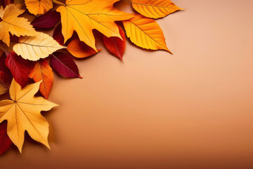 Fototapeta premium Autumn leaves on a brown background with copy space for your text
