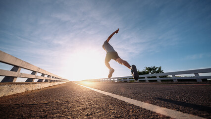 runners is running on the road at outdoors , healthy lifestyle and sport concepts.