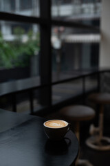 a cup of latte with a heart on the top