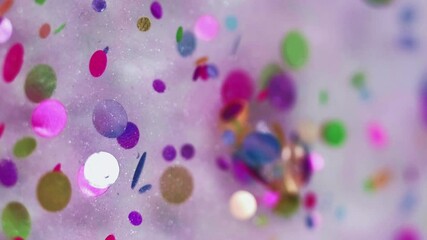 Bright sequins. Glitter ink. Defocused rainbow round shiny decoration particles floating shimmer translucent paint neon light abstract art background. - Powered by Adobe
