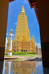 Stunning huge golden pagoda of Wat Bang Thong (Wat Mahathat Wachiramongkol) in Krabi Province, Thailand. Famous travel destination in southeast asia.
