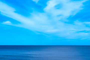 Nature of the beach and sea Summer with sunshine, sandy beaches, clear blue waters sparkling against the blue sky. On an island with good ecology and environment Background for summer vacation concept