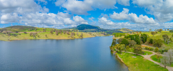 Aerial daytime views over Carcoar Dam with clouds
