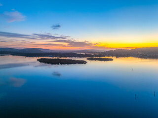 Sunrise along the waterfront with reflections on the bay water