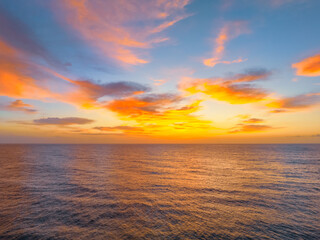 Aerial views of sunrise by the sea with clouds