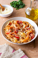 Pasta with shrimps, tomatoes and cheese. Healthy eating. Italian food.