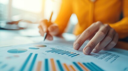 Entrepreneur reviewing a detailed business plan with graphs and charts, business strategy visualization
