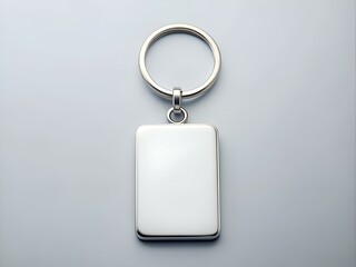Fototapeta premium A clean and professional mockup of a blank silver keychain with a rectangular tag.