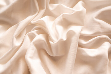 Obraz premium Cloth beige fabric texture woven background crumpled soft Pattern textile fabric silk natural fiber linen decor tablecloth material product eco drapery,wedding fashion presentaion cosmetic product.