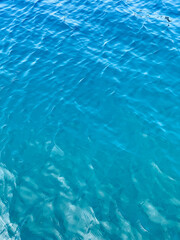 Turquoise Teal Blue calm water, clear blue water, gradient blue, perfect for background, vertical lake with waves