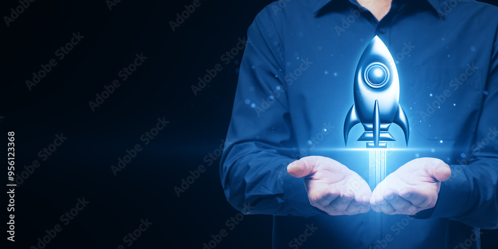 Poster close up of man hands holding creative glowing rocket spaceship hologram on dark blue background wit