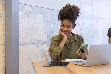 African American woman with smartphone, excited woman. 