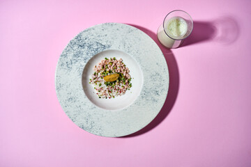 The dish features a vibrant mixture of chopped vegetables, herbs, and a protein component (possibly meat or seafood), all tossed in a cold, tangy kvass-based dressing. Okroshka