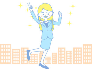 ビジネス街で飛び跳ねながらガッツポーズをするビジネスウーマン