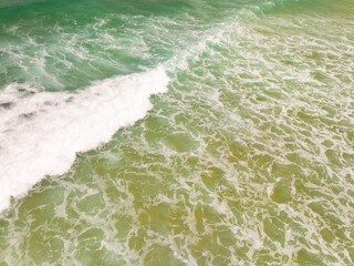 Beautiful sea beach and waves texture in sunny summer day background,Phuket Thailand