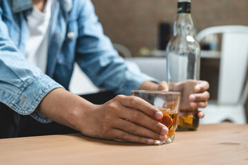 Alcoholism concept. Young man drinking alcohol too much.