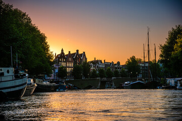 Naklejka premium Amsterdam Canal and Gabled Houses at Sunset - Netherlands