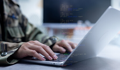close up soldier man as programmer hand typing command on keyboard laptop to check about software or configuration for military operation system in office room concept