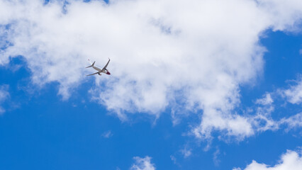 XL Jet Plane coming in for a landing in a bright sky