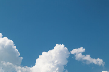 Clouds In Blue Sky. Clear blue skies with fluffy white clouds.