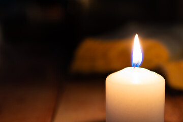 burning candle in the dark