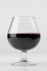 Red Wine Glass Positioned Centrally in a Vertical Frame on a White Background