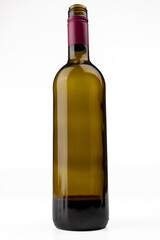 Vertical Shot of Central Wine Bottle on White Surface