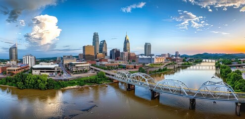 Naklejka premium This stunning photograph offers a panoramic view of Nashville's skyline, highlighting the city's modern architecture and its connection to the Cumberland River.