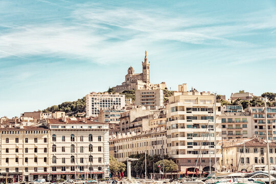 View of the Marseille waterfront with the Notre-Dame de la Garde on top of the hill, Marseille, France
