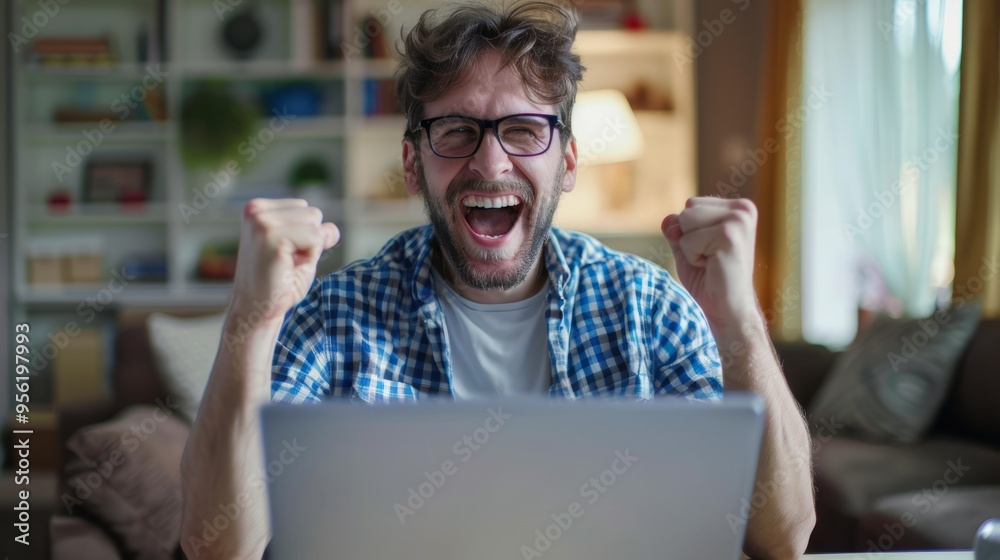 Poster a man is sitting in front of a laptop, smiling