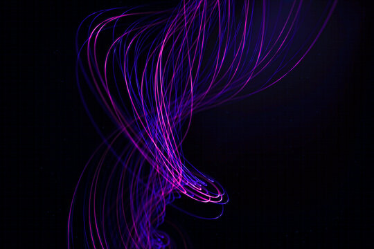 Purple and blue light trails swirling against black background