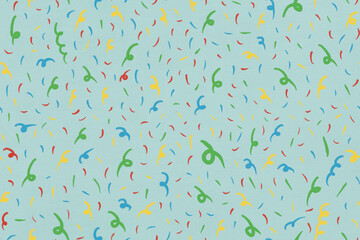 Multi colored confetti against green background