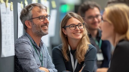 Colleagues in a breakout session, using a flip chart to brainstorm and engage in a lively discussion about new initiatives.