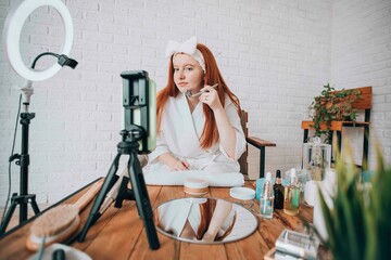 Beauty influencer creating a skincare tutorial at home.