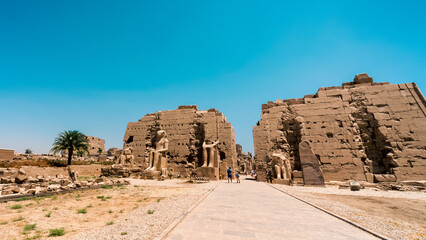 antique in the Karnak temple and tourists in luxury