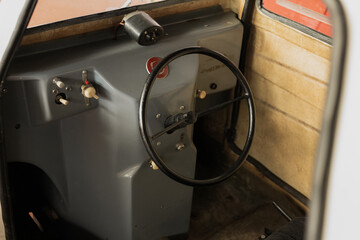 Photo of the interior of an old car. steering wheel