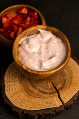 fresh natural yogurt with added strawberry flavor with berries