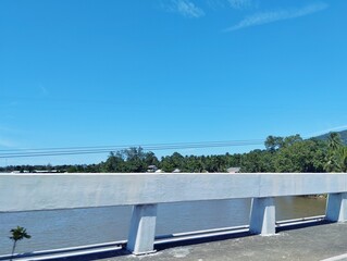 Bridge over water under the blue sky