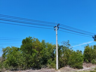 Obraz premium Power line and wires under the blue sky 