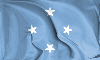 An up close view of Micronesia flag flying textures