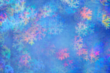 Defocused abstract figured bokeh background, glare from lights as snowflakes, blurred snowflake bokeh as winter holiday texture. Creative New Year aesthetic textured lighting pattern for festive