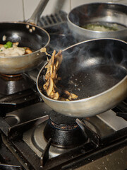 vegetables cooking in the pan at a restaurant
