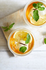 Homemade iced peach tea with lemon