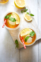 Homemade iced peach tea with lemon