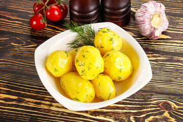 Boiled potato with oil and dill