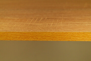 Close-up edge of cabinet shelving shelf with wood textures and grains. Design design of home furniture. Blank Macro Background with Copy Space for Artwork