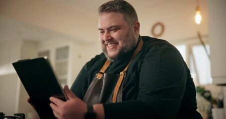 Happy man, home and tablet in kitchen with celebration, good news or success as entrepreneur. Male person, excited and technology for networking, research or recipe for cooking or meal preparation